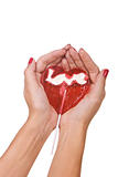 Heart shape lollipop in a hand