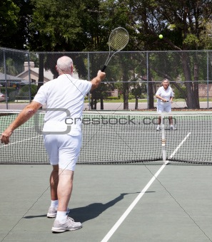 Senior Couple Plays Tennis