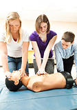 Teenage Students Practicing CPR