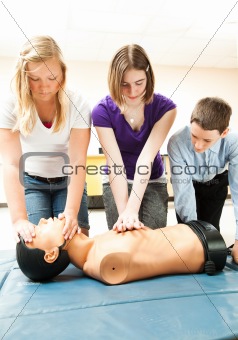 Teenage Students Practicing CPR
