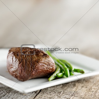steak with green beans and copyspace
