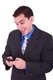 young and smiling man looking at his cellphone 