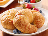 breakfast with two croissants and berries.