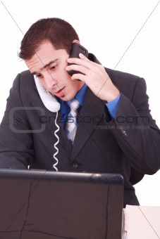 Isolated Stressed Businessman At His Desk Working - White Background
