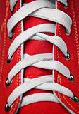 Red old-fashioned gym shoe - lacing