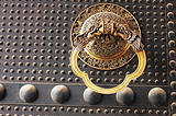Doorknob on an ancient iron door