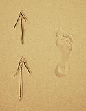 Trace of a human foot on sand. Tourist traffic.