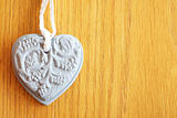 Stone heart shape on wooden background