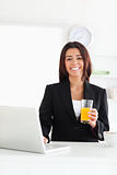 Good looking woman in suit relaxing with her laptop 