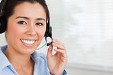 Portrait of a beautiful woman with a headset helping customers 
