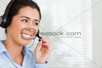 Portrait of a pretty woman with a headset helping customers