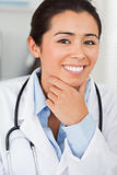 Attractive female doctor with a stethoscope posing