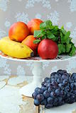 assortment of summer fruits - peaches, apples, grapes, bananas