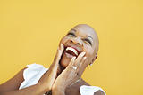 mature african woman smiling for joy 