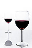 two wineglasses with red wine