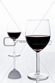two wineglasses with red wine
