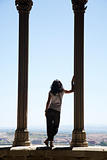 woman watching city from great window