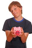 Skeptical teenager with piggy bank