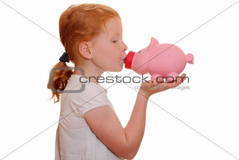 Girl kisses a piggy bank