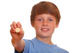 Boy showing a coin
