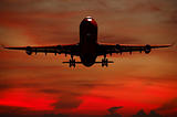 Air travel - Silhouett of plane and sunset