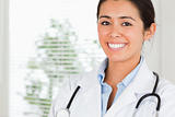 Portrait of a beautiful female doctor with a stethoscope posing 