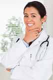 Beautiful female doctor with a stethoscope posing while standing