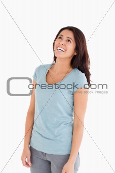 Happy beautiful woman laughing while standing