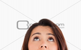 Portrait of a beautiful woman looking up while standing