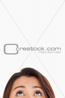 Woman eyes looking up while standing