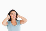 Attractive woman with headphones looking at something