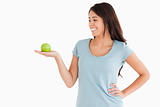 Beautiful woman holding a green apple