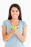 Attractive woman holding a green apple