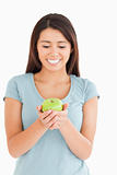 Gorgeous woman holding a green apple