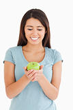 Pretty woman holding a green apple