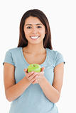 Lovely woman holding a green apple