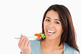Good looking woman eating salad