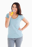 Gorgeous woman drinking a glass of orange juice