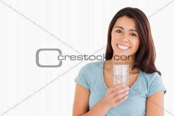 Lovely woman holding a glass of water