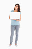 Gorgeous woman holding a laptop while posing