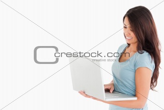 Good looking woman relaxing with her laptop