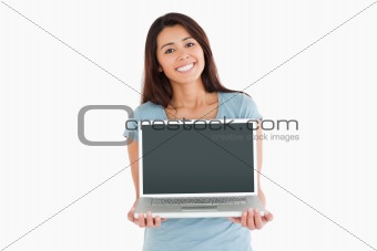 Beautiful woman posing with her laptop