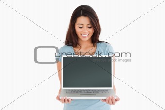 Attractive woman posing with her laptop