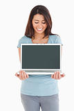 Pretty woman posing with her laptop