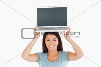 Lovely woman posing with her laptop