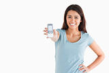 Good looking woman showing her mobile phone
