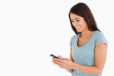 Attractive woman writing a text on her mobile phone