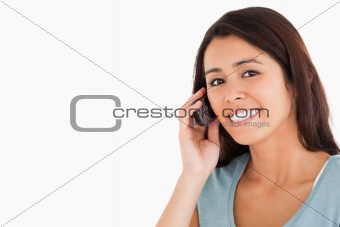 Portrait of a good looking woman on the phone