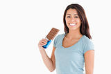 Lovely female holding a chocolate bar