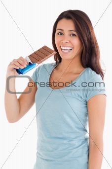 Lovely woman eating a chocolate bar